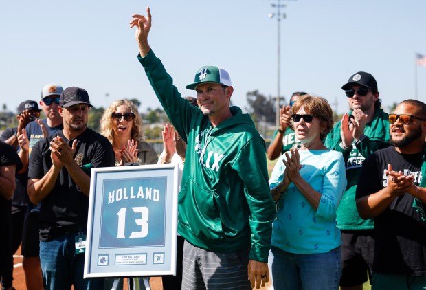 Former Helix baseball coach Cole Holland is acknowledged during a pregame ceremony honoring the schoolxe2x80x99s 75 years of baseball at Helix High School on Friday, April 17, 2026 in San Diego, California. (Meg McLaughlin / The San Diego Union-Tribune)