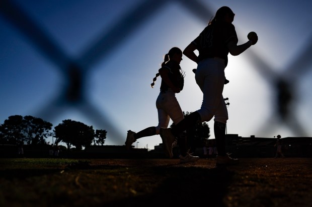 Steele Canyon players run back to the dugout during their game against Helix at Helix High School on Wednesday, April 8, 2026 in La Mesa, California. (Meg McLaughlin / The San Diego Union-Tribune)