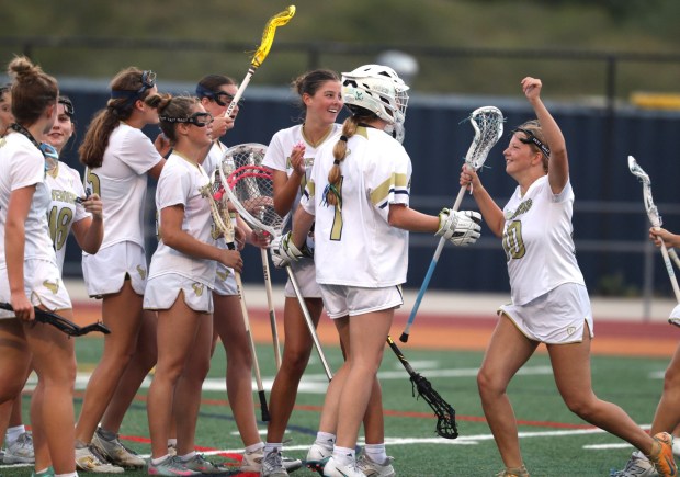 La Costa Canyon lacrosse players celebrate their 14-6 win over Marin Catholic at La Costa Canyon High School in Carlsbad on Friday, April 10, 2026. (Hayne Palmour IV / For The San Diego Union-Tribune)