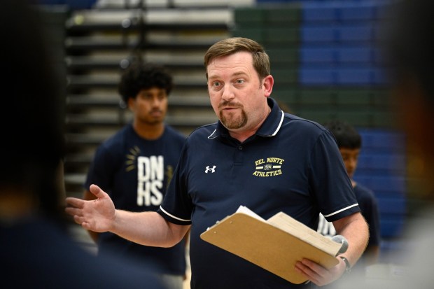 Del Norte Badminton coach Michael Buxton talks to his team before a game against Vista April 13, 2026 in Poway, Calif. (Photo by Denis Poroy)