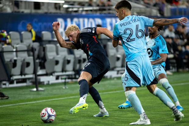 SDFC's Osvald Soe is pressured by Minnesota United's, Joaquin Pereyra during Saturday's MLS match at Snapdragon Stadium in San Diego, CA. (Xavier Hernandez for the UT)