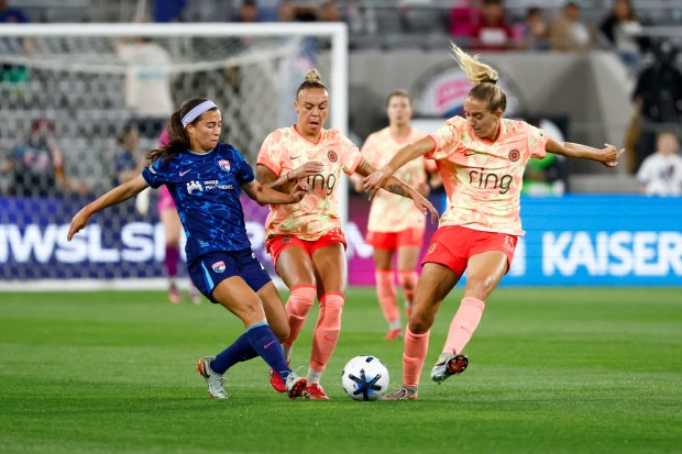 Lia Godfrey of the San Diego Wave FC and M.A. Vignola of the Portland Thorns FC battle for control of the ball during their match at Snapdragon Stadium on Wednesday, March 25, 2026 in San Diego, California. (Meg McLaughlin / The San Diego Union-Tribune)