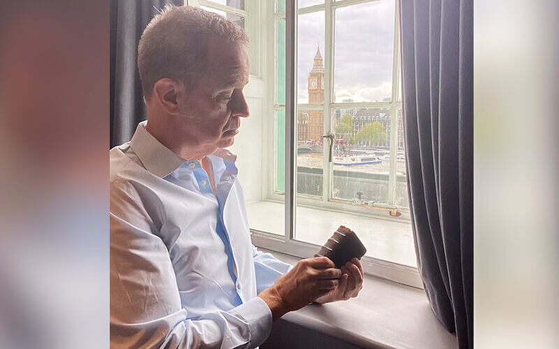 Professor Marlin E. Blaine holds a book