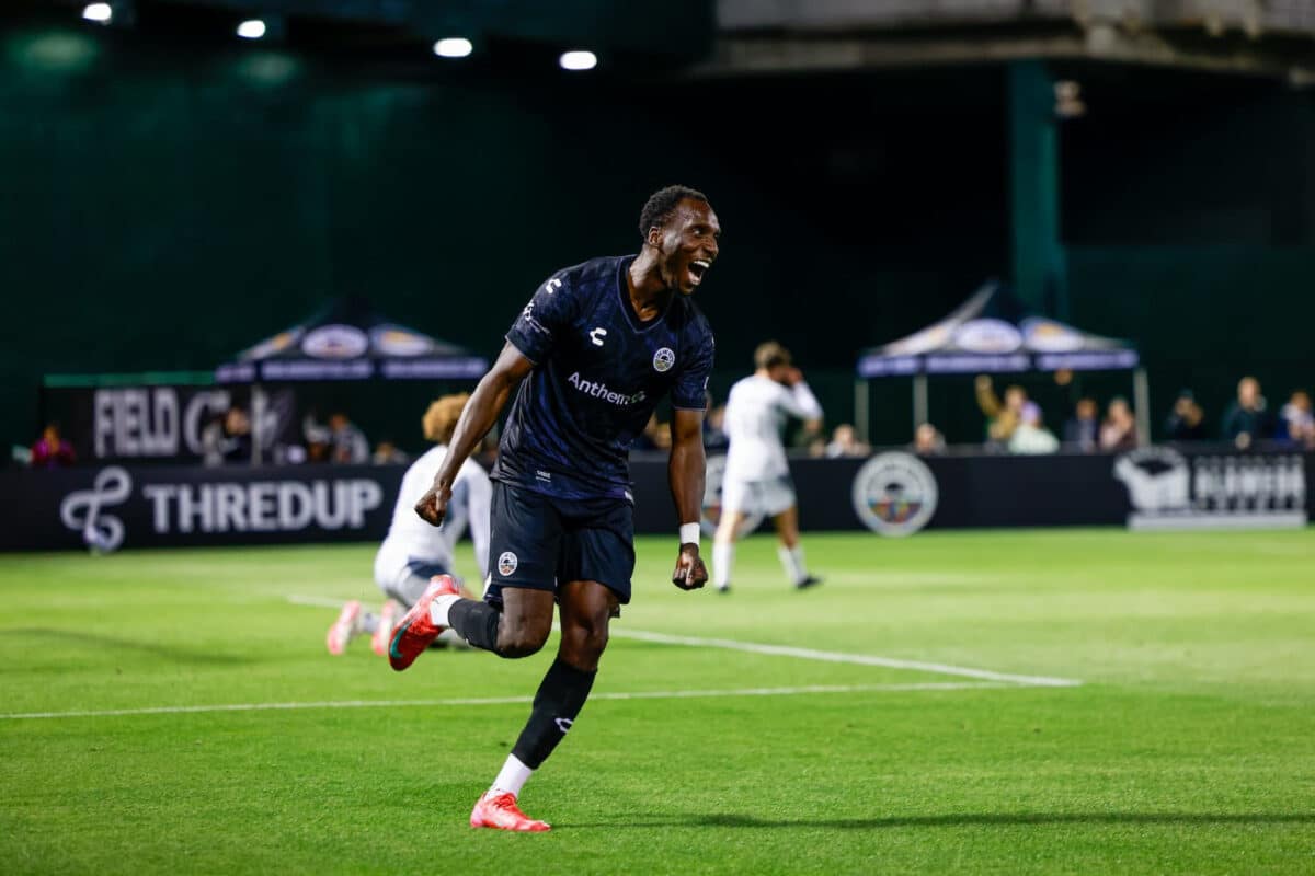 Alameda Post - An Oakland Roots player, Peter Wilson, celebrates on the field. 