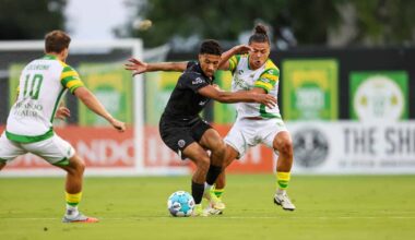 Alameda Post - Oakand Roots players dribble the ball against Tampa Bay Rowdies.