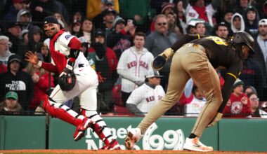 Red Sox catcher Carlos Narváez chases after the ball as Padres right fielder Fernando Tatis Jr. scores the winning run in the ninth inning.