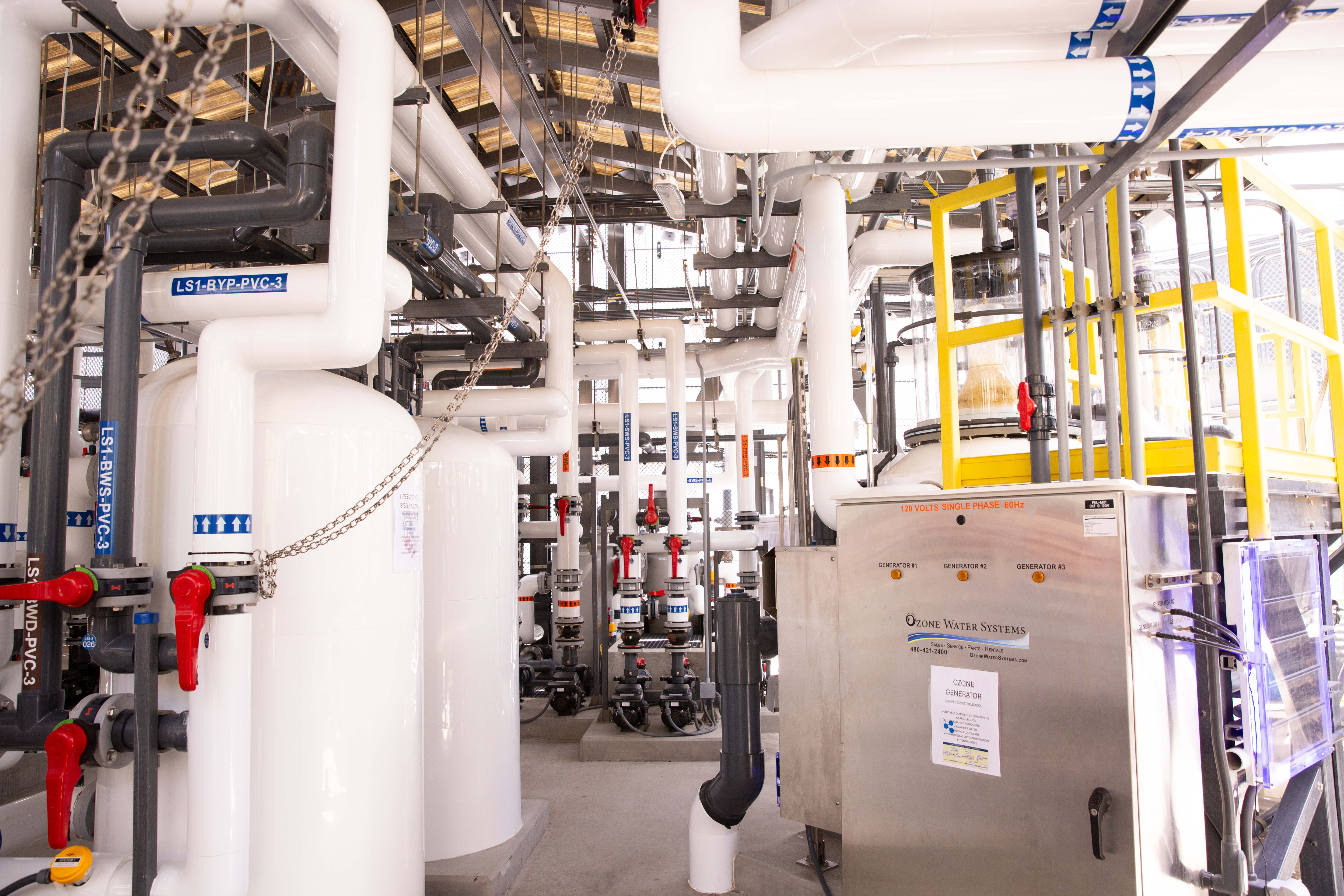 A maze of pipes, tanks and electrical panels make up...