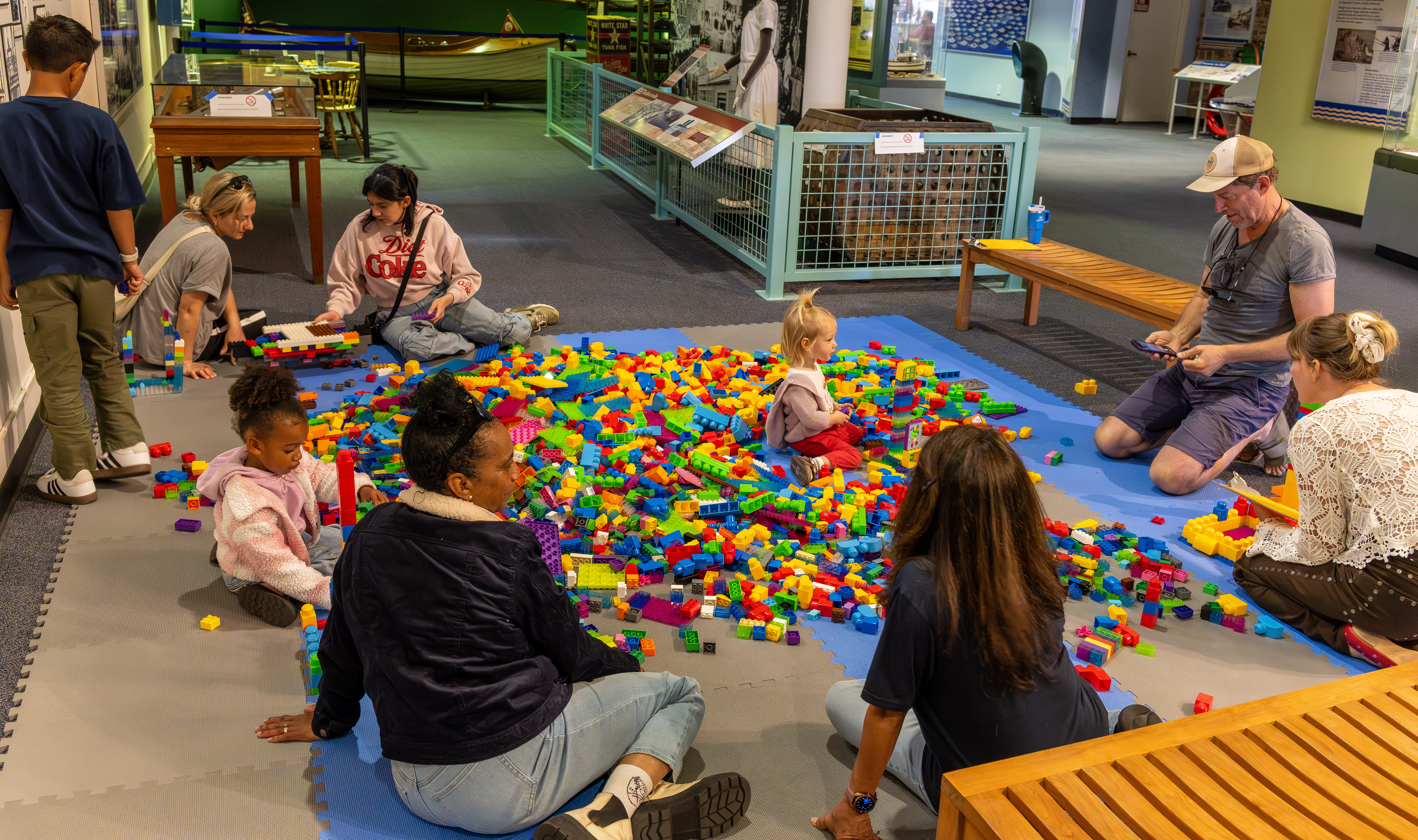Dozens of children gather to take part in a Lego...