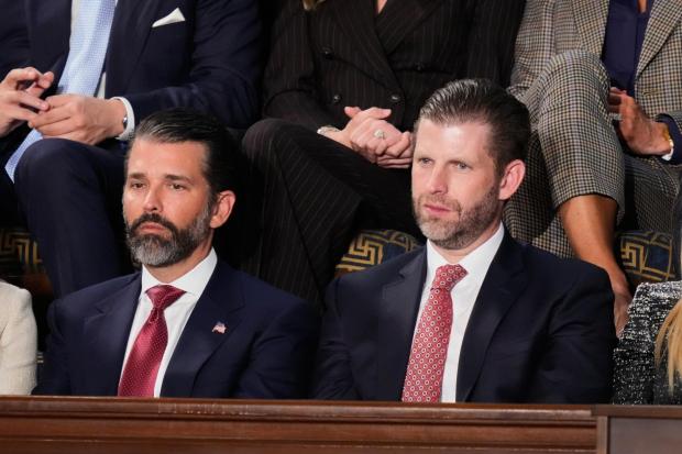 Donald Trump Jr. and Eric Trump listen to President Donald Trump's State of the Union address.