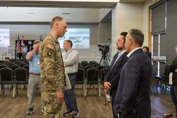 Col. Andrew J. Baker, U.S. Army Corps of Engineers Los Angeles District commander, speaks with Mayor Gustavo V. Camacho and city manager Steve Carmona before the start of a town hall at Pico Park in Pico Rivera on April 16. About 60 residents heard news on the upcoming construction for the Whittier Narrows Dam Safety Modification Project in Pico Rivera, California. (U.S. Army Corps of Engineers photo by Shawn Davis, USACE Los Angeles District Public Affairs)