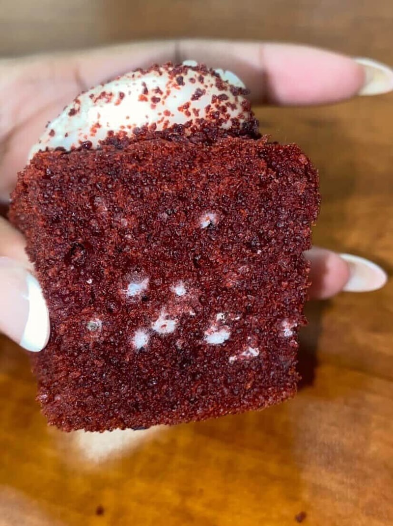 Cake that looked moldy but which USC said was batter that  “did not fully bake during production” at Everybody's Kitchen.