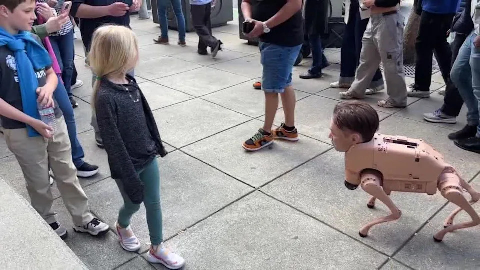<div>An autonomous robot head of Elon Musk struts around San Francisco outside a Giants game at Oracle Park. April 8, 2026</div>