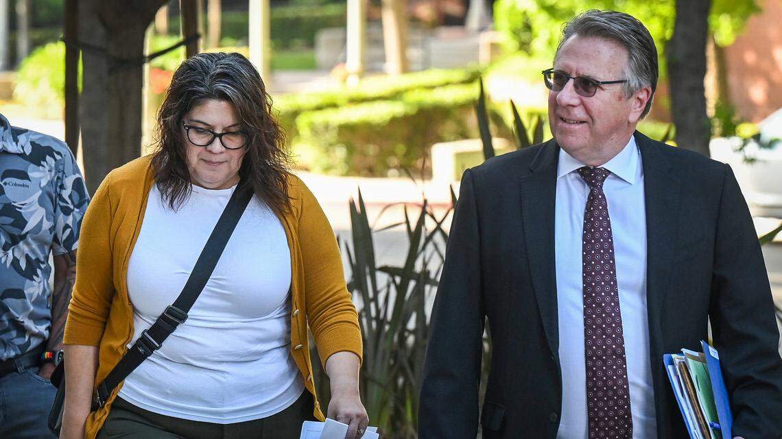 Suliana Caldwell, the former operations manager for Fresno Arts Council, arrives at the Robert E. Coyle United States Courthouse with her lawyer on Monday, April 20, 2026. Caldwell was expected to appear before a federal judge and enter her plea of guilty for stealing $1.8 million from the council.