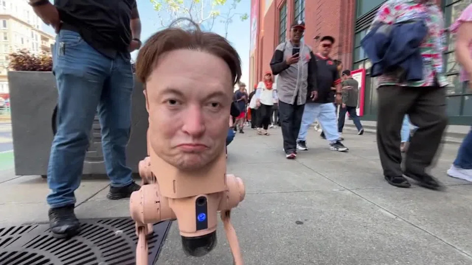 <div>Autonomous Elon Musk head walks around San Francisco outside Giants game. April 8, 2026</div>