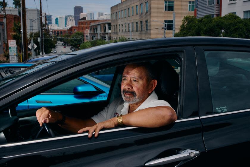SAN FRANCISCO, CA - APRIL 15, 2026: John Mejia, a Lyft and Uber driver, poses in his car for a portrait before attending a SEIU meeting about unionizing gig drivers as high gas prices have made it hard for gig drivers to make a living, cutting into they profits on Wednesday, April 15, 2026 in San Francisco, CA. (Jess Lynn Goss/For The Times)