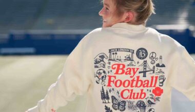 Bay FC player modeling Bay FC x Oaklandish sweatshirt at NWSL PayPal Park in San Jose.