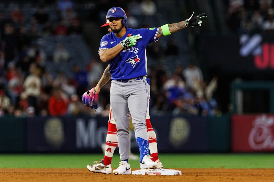 Lenyn Sosa #50 of the Toronto Blue Jays celebrates after getting on base during an MLB game against the Los Angeles Angels at Angel Stadium on April 21, 2026 in Anaheim, California.