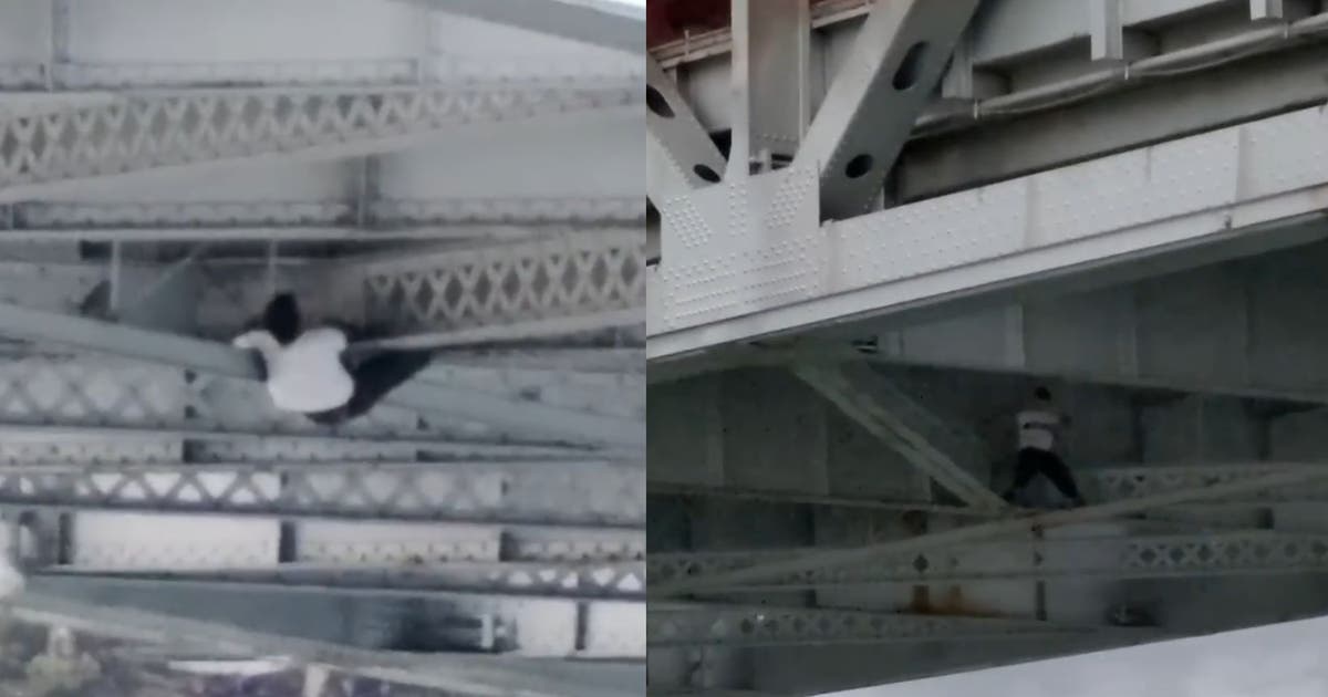 Bay Bridge chase: Stolen car suspect hangs from beams