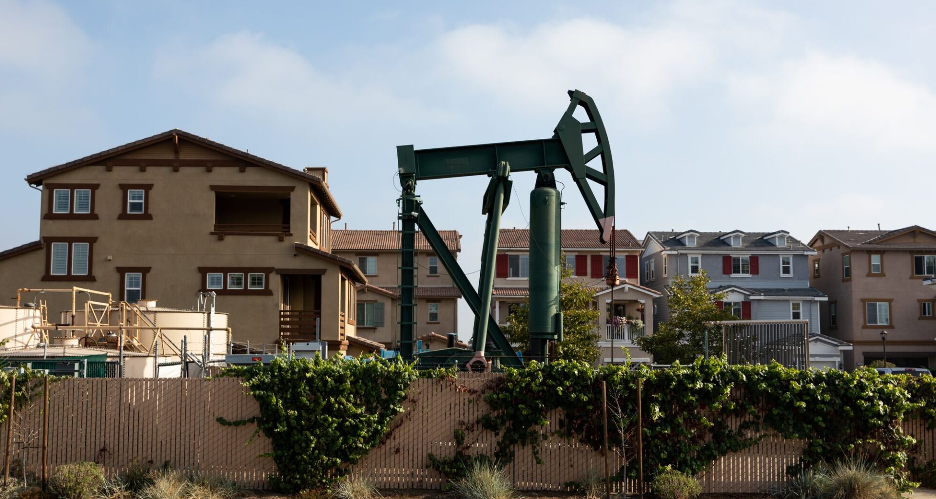Signal Hill, an affluent suburb of Long Beach, features dozens of active oil wells and derricks around the town many in commercial parking lots and residential areas only feet from homes.