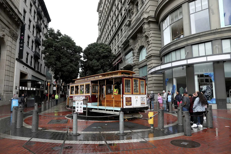 FILE: People line up for the popular cable car stop. (Justin Sullivan/Getty Images)