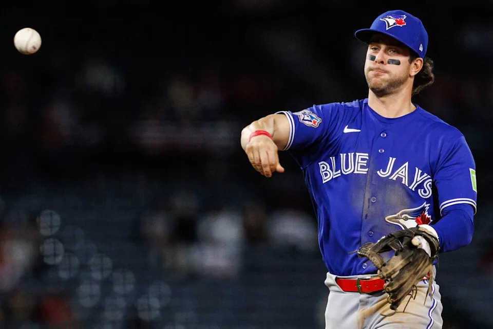 Ernie Clement #22 of the Toronto Blue Jays throws the ball during an MLB game against the Los Angeles Angels at Angel Stadium on April 21, 2026 in Anaheim, California.