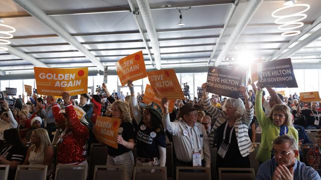 Attendees hold up signs in support of governor candidate Steve Hilton during the 2026 California Republican Party Spring Convention at the Sheraton San Diego Resort on Saturday, April 11, 2026. 