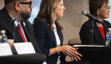 female panetlist talking during press conference