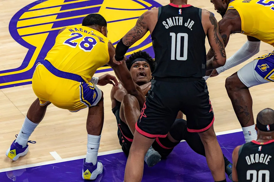 Los Angeles Lakers forward Rui Hachimura (28) helping a Rockets player to his feet during an NBA basketball game against the Houston Rockets on April 18th, 2026 in Los Angeles, CA.