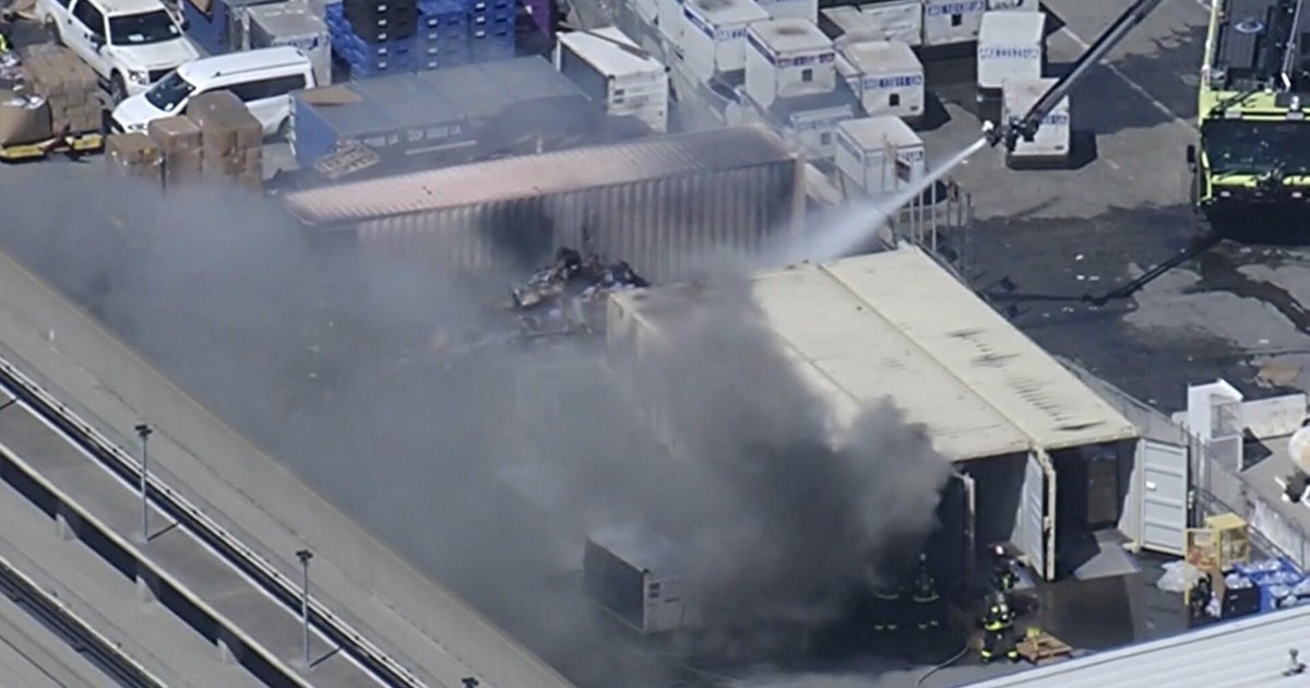 Fire at San Francisco International Airport burns cargo containers, debris