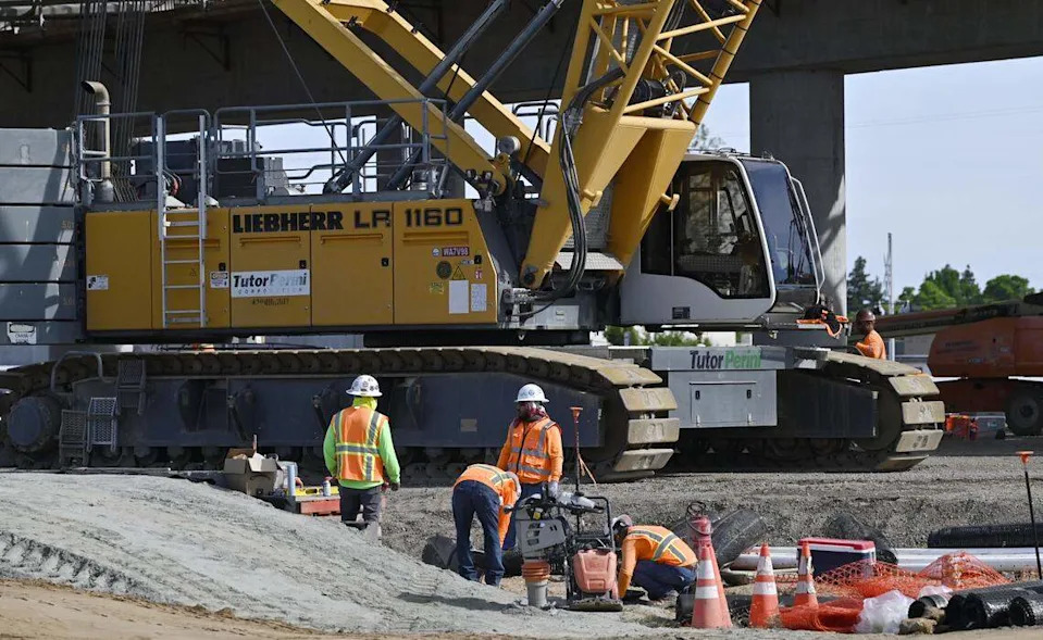 Workers continue construction on High Speed Rail infrastructure near Shaw Avenue, seen during a tour of HSR work Wednesday, April 15, 2026 in Fresno.