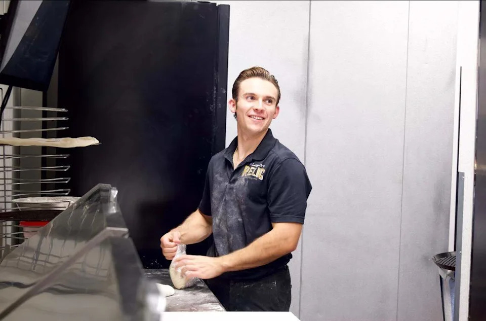Jeremiah Willey makes a pizza. He and his family opened Gold Dust Pizza in El Dorado Hills on April 22.