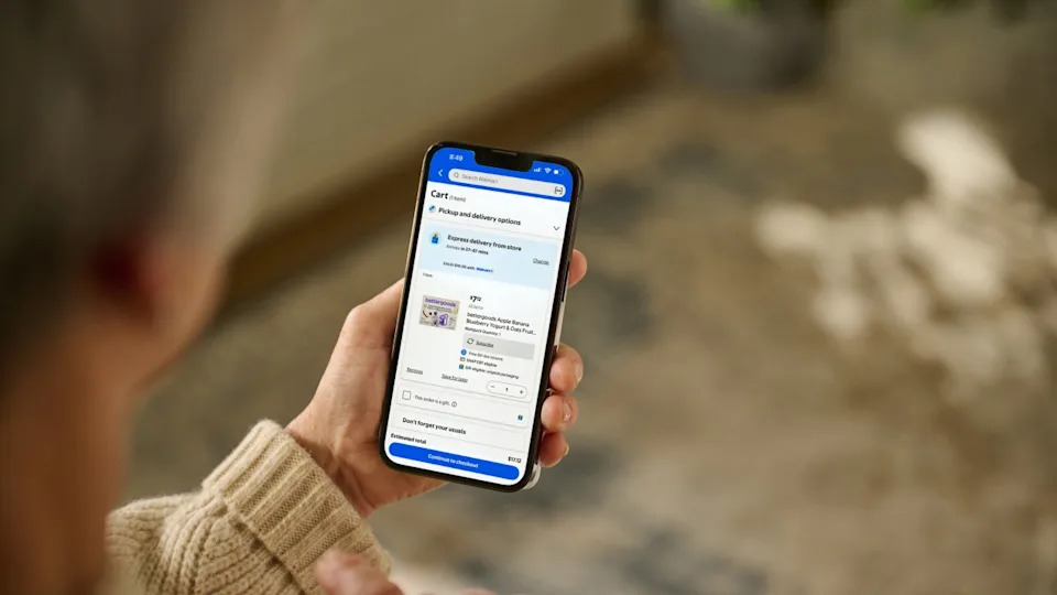 Person using a smartphone for Walmart Express Delivery. (Credit: Walmart)
