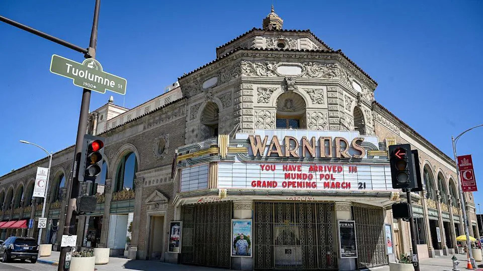 The marquee at the Warnors Theatre building in downtown Fresno welcomes Mundo Pol, their newest tenant in their complex of units within the historic venue.