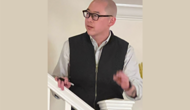 Jay Cheng, speaking on a staircase