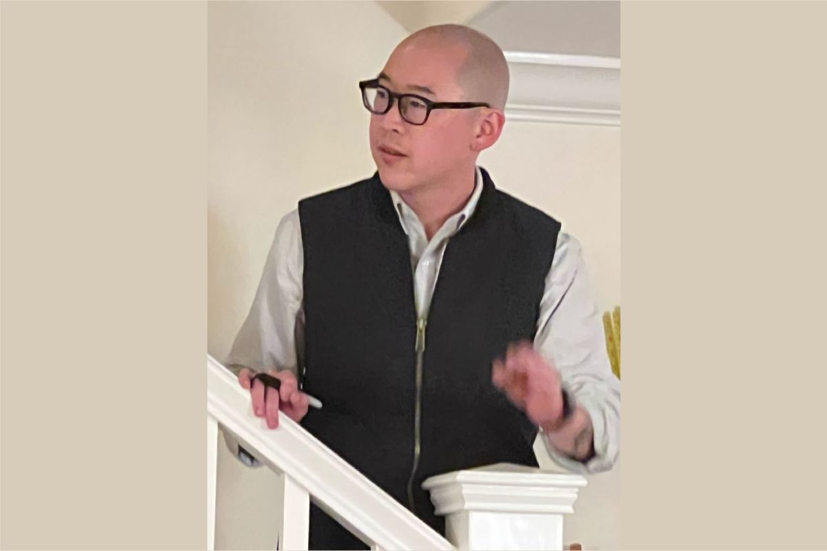 Jay Cheng, speaking on a staircase