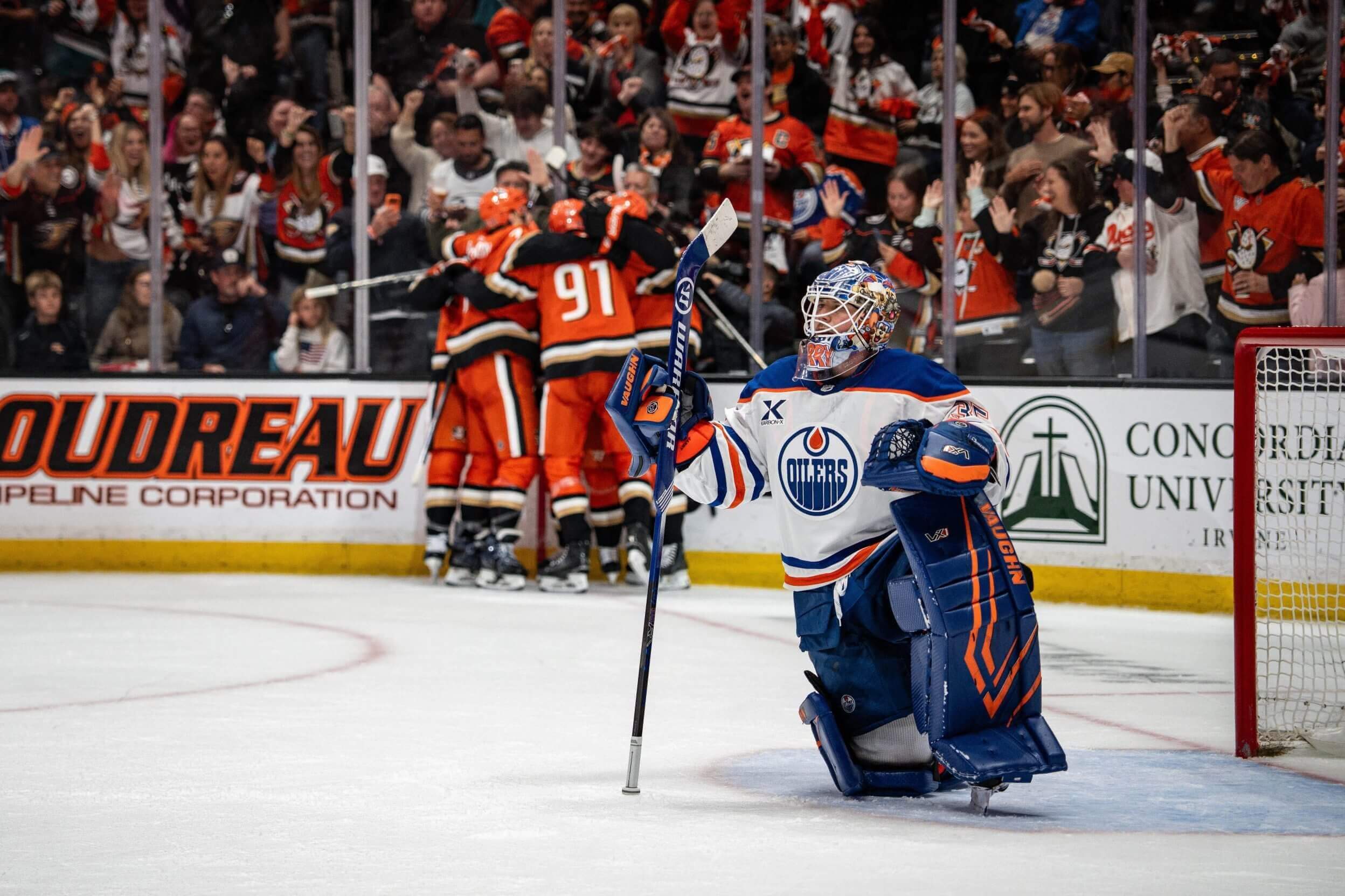 Anaheim Ducks players celebrate a goal while Edmonton Oilers goaltender Tristan Jarry looks at the replay during the second period in game four of the first round of the 2026 Stanley Cup playoffs in Anaheim, California, on April; 26, 2026