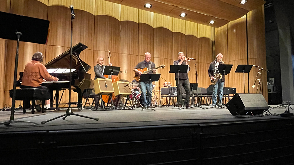 group of musicians performing on a stage