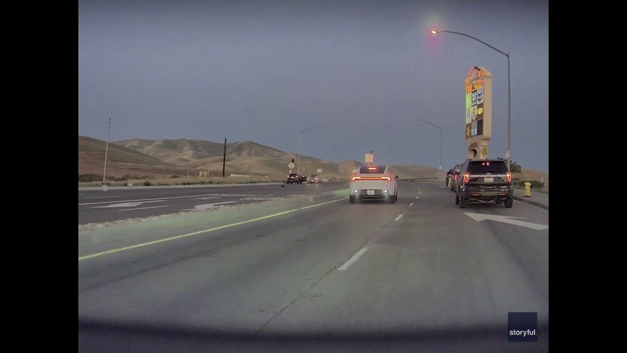 Dashcam shows ICE shooting, car reversing