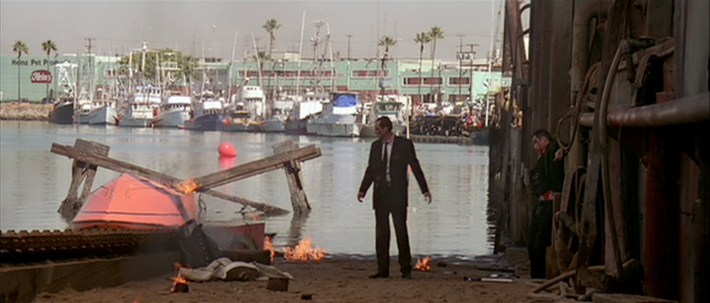 a man stands at a dock