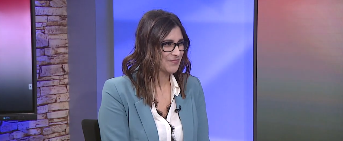 woman seated in an interview