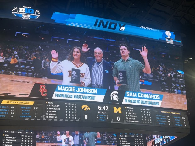 Bishop's School graduate Maggie Johnson and Sam Edwards accept the Wayne Duke Postgraduate Award from the Big Ten Conference. (Tom Johnson)