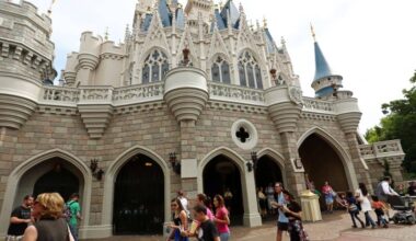 Visitors walk in front of Cinderella Castle at Magic Kingdom on the Fantasyland side.
