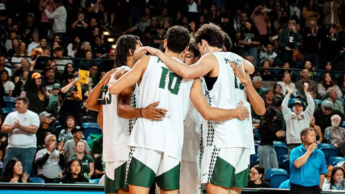 volleyball players huddling