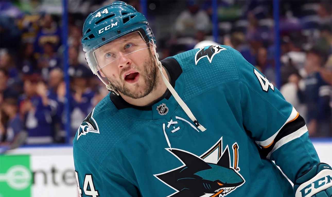 A photo-edit showing NHL defenseman Morgan Rielly wearing a teal San Jose Sharks alternate captain's jersey, number 44. speculative trade scenario image.