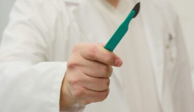 person holding scalpel