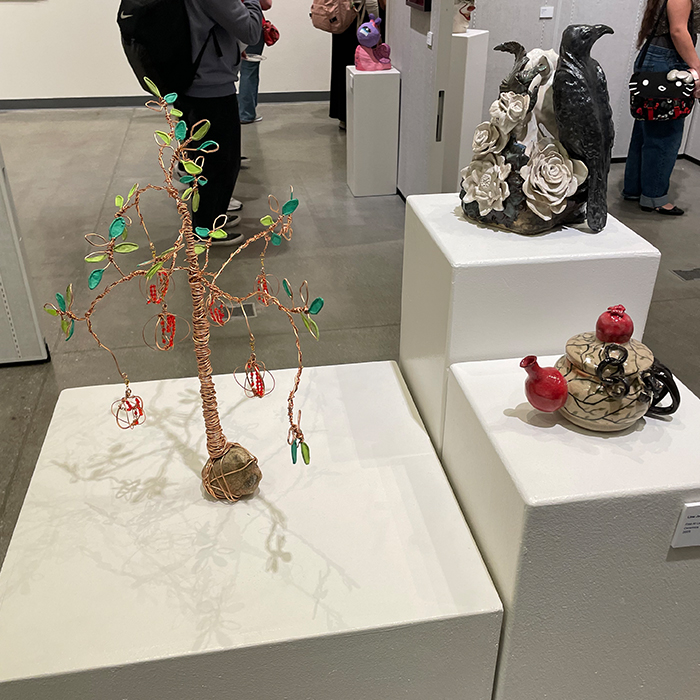 three 3-D art pieces on display in the art gallery