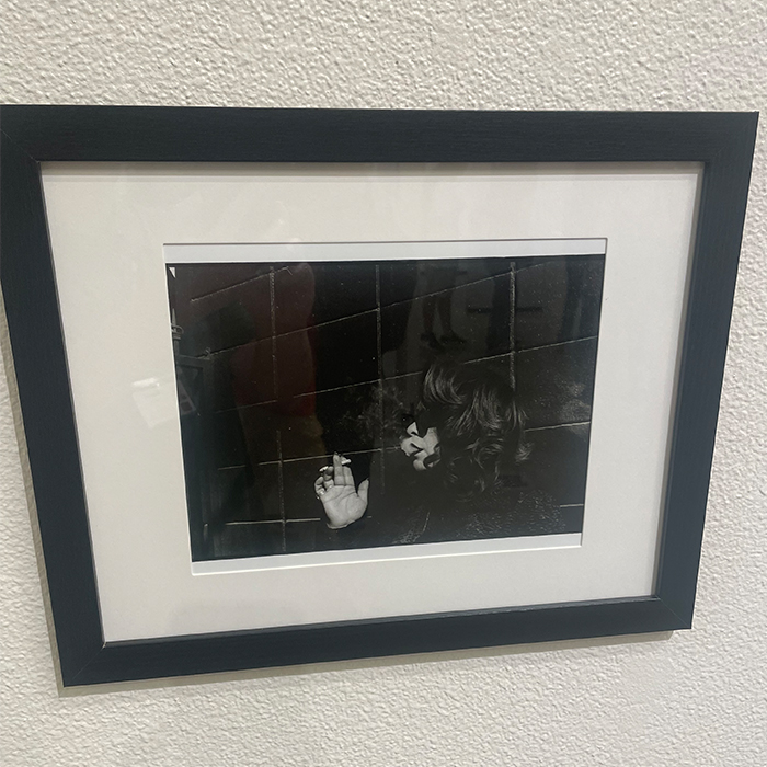 black and white photo of a woman smoking a cigarette
