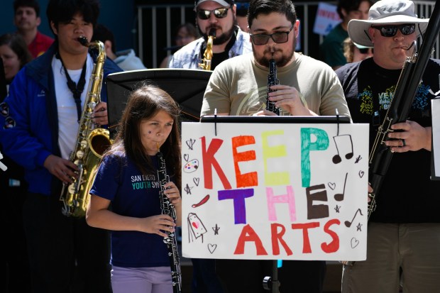 At the Civic Center Plaza on Monday, April 20, 2026, in San Diego, musicians taking part in a demonstration performed with others protesting the proposed budget cut by Mayor Todd Gloria to the arts. (Nelvin C. Cepeda / The San Diego Union-Tribune)