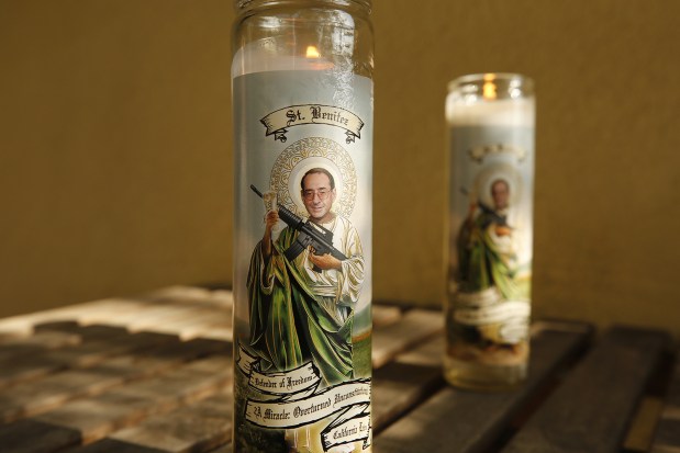 Prayer candles available online contain an image of federal Judge Roger T. Benitez as a haloed "St. Benitez," holding an AR-15. (Al Seib/Los Angeles Times/TNS)