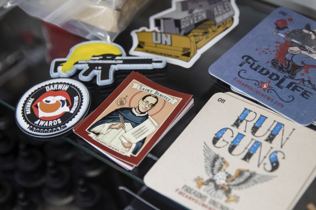 "Saint Benitez" stickers of U.S. District Judge Roger Benitez for sale at Hiram's Guns/Firearms Unknown in El Cajon on Aug. 3, 2021. (Kristian Carreon / U-T file)